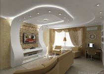 Modern çizgiler, led aydınlatmalar ve oval çıkıntılar ile olukça şık görünen alçı tavan modeli.
